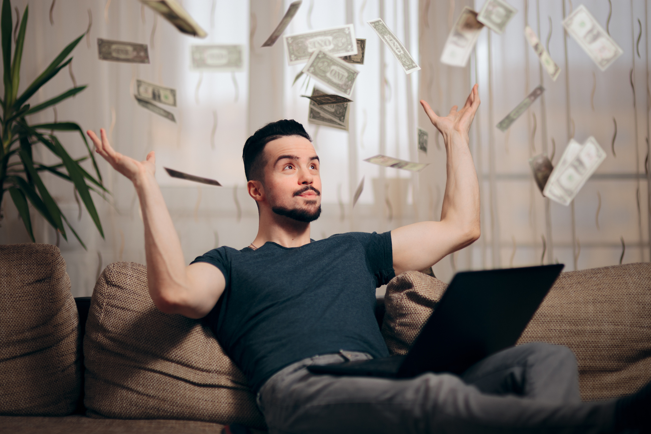 Man Making Money from Home on his Laptop