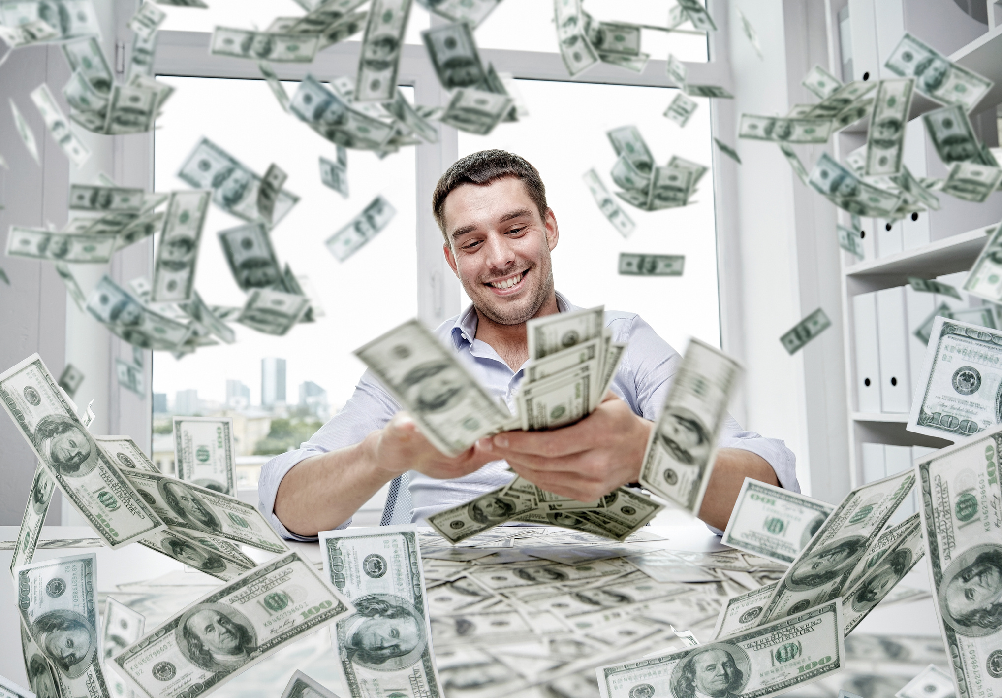 Happy Businessman with Heap of Money