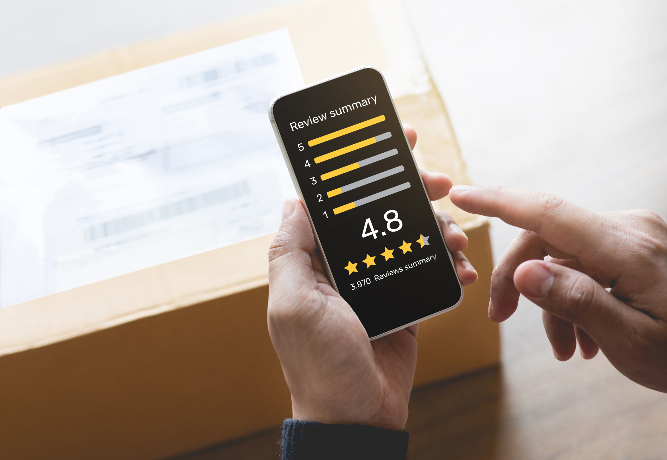 Consumer reviews concepts with young person putting report score on application smartphone and packaging product behind.rating or feedback