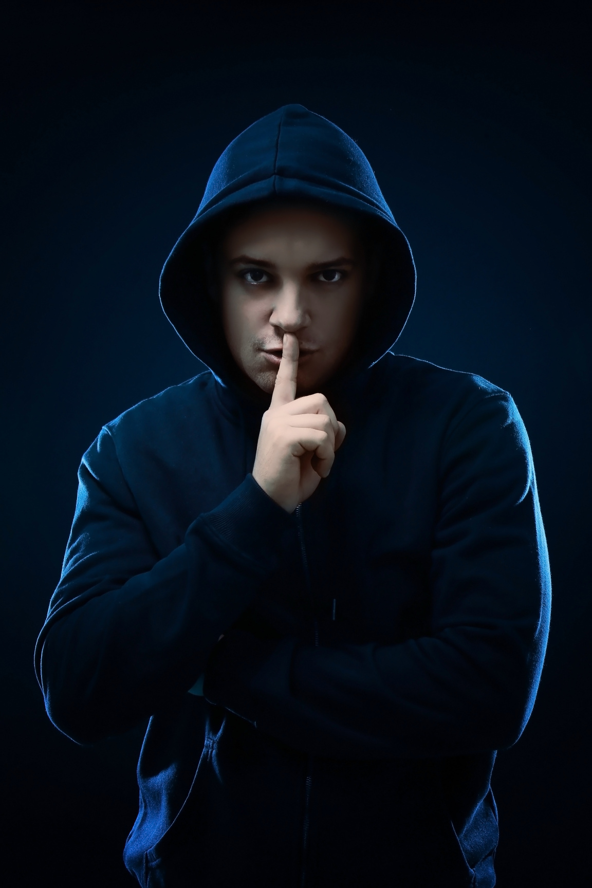 A Male Hacker on a Dark Background